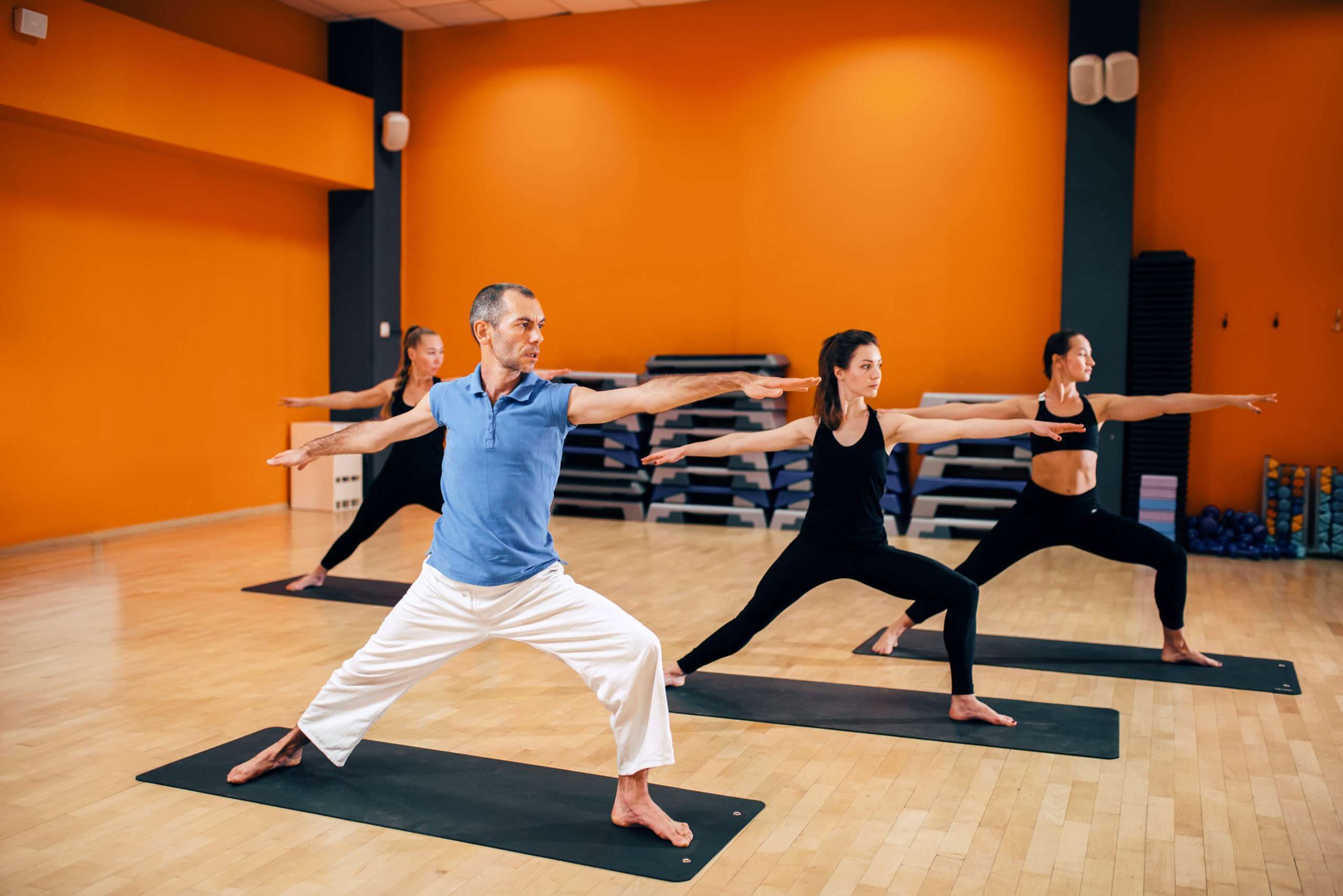 yoga-training-female-group-with-trainer-in-action-2024-11-27-04-23-27-utc-scaled.jpg